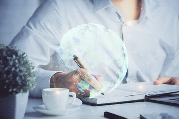 Man's hands working with notes background. Social networking scheme . Mixed media