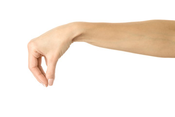 Hand picking, holding, grabbing or reaching. Woman hand gesturing isolated on white