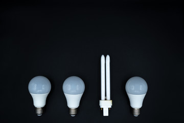 Individuality, being different and unique concept. Lightbulbs with copy space, one fluorescent.