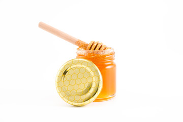 honey and honey in jar on white background
