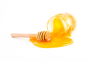 honey and honey in jar on white background