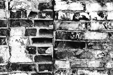 Obraz premium Texture of a brick wall with cracks and scratches