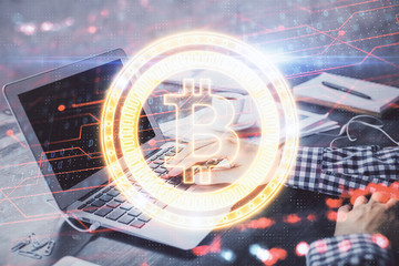 Blockchain theme hologram with man working on computer on background. Concept of crypto chain. Double exposure.