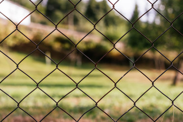 iron chain link fence against sky