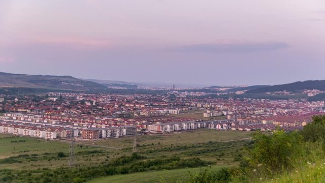 Time lapse of busy Cluj Napoca city highways at sunset
