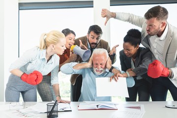 Colleagues criticizing boss for his wrong decision making - Powered by Adobe
