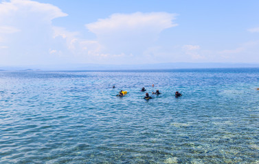 Group of scuba divers ready for diving