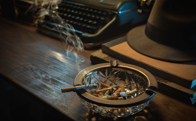 Film noir style desktop with ashtray