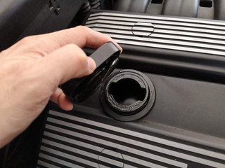 Hole for filling the lube in a car engine