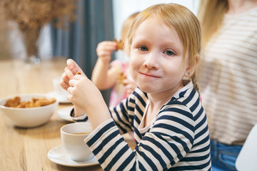 Portrait of a cute little girl in the kitchen