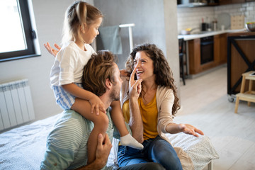 Happy family having fun times at home