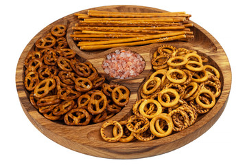 A set of three delicious beer snacks. On a beautiful wooden plate.