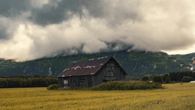Abandoned Barnhouse On The Lush Field In Hemsedal, Norway On A Cloudy Autumn Day - timelapse - zoom-out shot