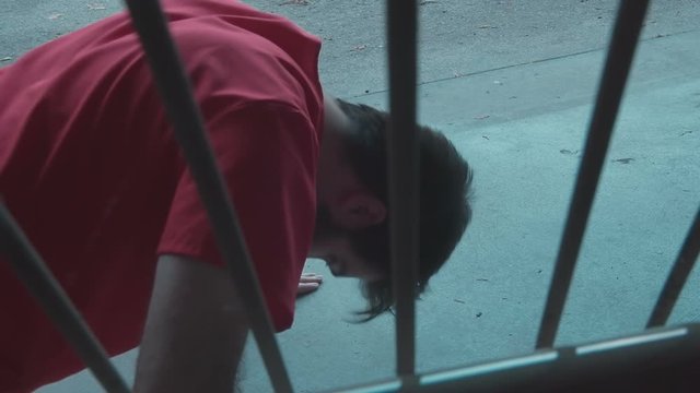 prisoner working out doing pushups