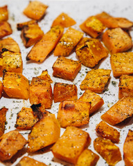 Roasted oven baked sliced pumpkin - vegetarian food cooking
