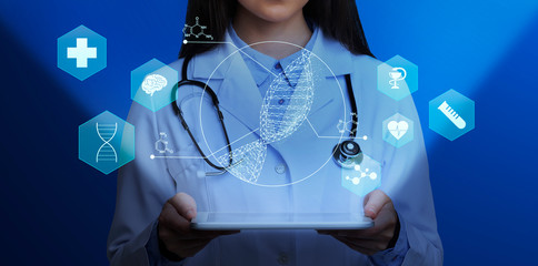 Medical genetics. Female doctor holding tablet computer with DNA helix and other medical icons above screen, collage