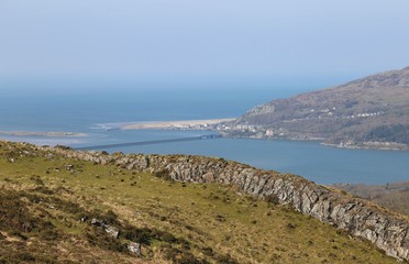 Fototapeta na wymiar A mountain top view across the Mawddach Estuary towards Barmouth, Gwynedd, Wales.