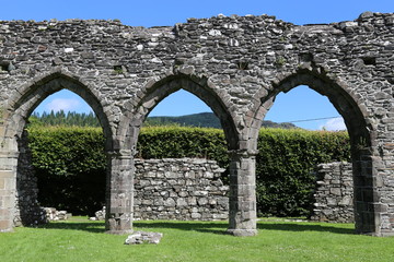 Fototapeta na wymiar Arched windows in the ancient Cymer Abbey at Llanelltyd, Gwynedd, Wales, UK.