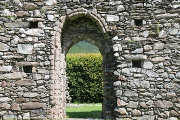 An arched doorway in the ancient Cymer Abbey at Llanelltyd, Gwynedd, Wales, UK.