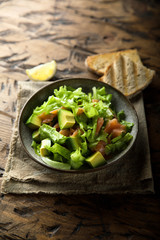 Healthy avocado salad with smoked salmon