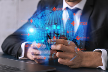 Businessman using phone. World map hologram. Multiexposure. International business concept.
