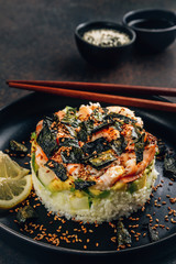Spicy shrimp sushi stacks with layers of sushi rice, cucumbers and avocado spicy shrimp and furikake
