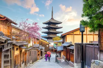 Tuinposter Old town Kyoto during sakura season © f11photo