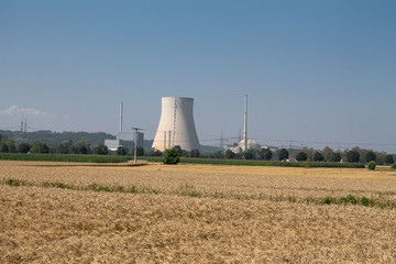 Fototapeta na wymiar On the right the cooling tower in the middle the reactor dome and on the left behind the machine house with the steam turbines of a nuclear power plant.