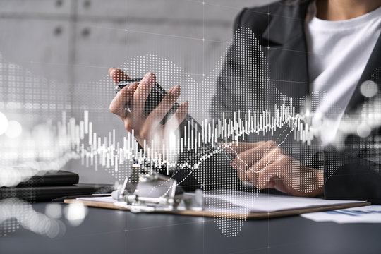 Businesswoman using smart phone in office. Forex chart hologram. On-line trading stock market concept. Double exposure.