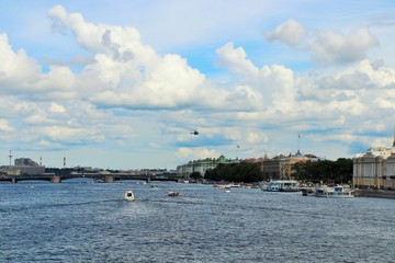 Fototapeta premium View from the bridge to the Neva river cloudy sky