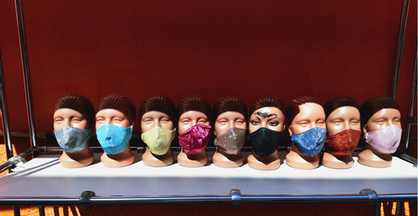 Multi-colored protective masks on mannequins