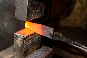 Forging molten metal. Making knives.
