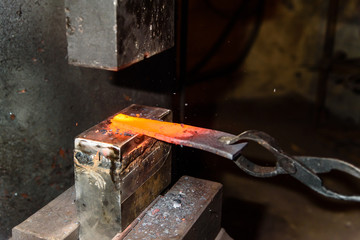 Forging molten metal. Making knives.