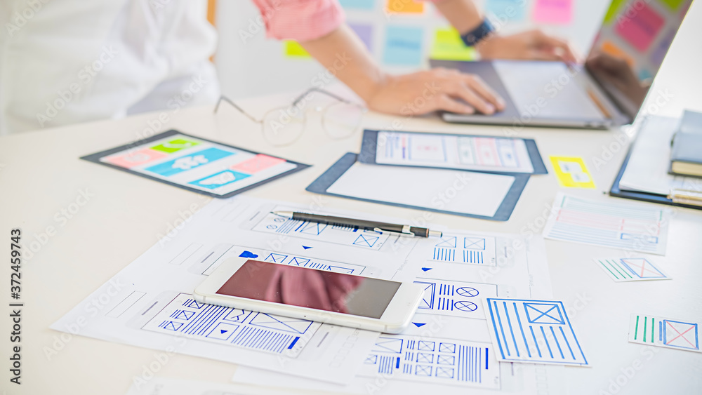 Wall mural creative web designer planning application and developing template layout, framework for mobile phon