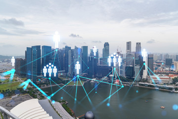 Social media icons hologram over panorama city view of Singapore, Asia. The concept of people...