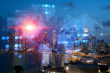 Hologram of Earth planet map on night panoramic cityscape of Singapore, Asia. The concept of international companies. Multi Exposure.