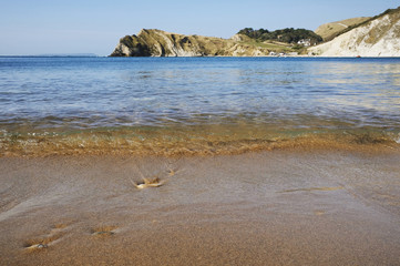 A calm  Lulworth Cove on the Jurassic Coast, Dorset, UK