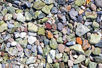 colourful stones on the beach. sunny day. selective focus