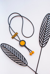 Minimalist black ochre necklace. Fashion jewelry background.