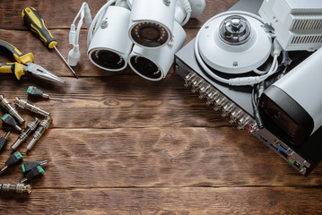 Video surveillance accessories and equipment flat lay background.