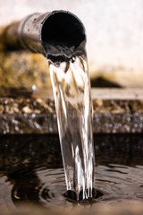 Naklejka na ściany i meble water flowing from a fountain
