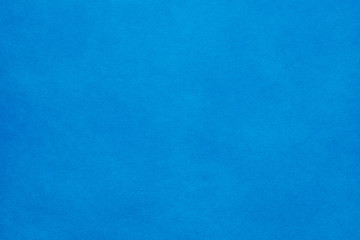 Paper background. The paper texture is blue. An empty page with a copy of the space.