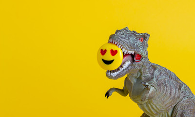 Dinosaur with a smiley in his teeth Toy. Creative idea. Concept.
