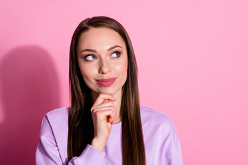 Closeup photo of attractive beautiful lady arms on chin interested wondered look up side empty space thinking clever person wear casual purple sweater isolated pink pastel color background