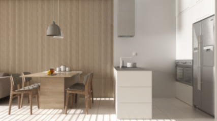 Blur background interior design, modern living room with wooden wall details, sofa, dining table with chairs, kitchen with island, appliances and pendant lamps. Tiles floor