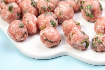 Top view of raw meat balls isolated on white. Meatballs and meatballs