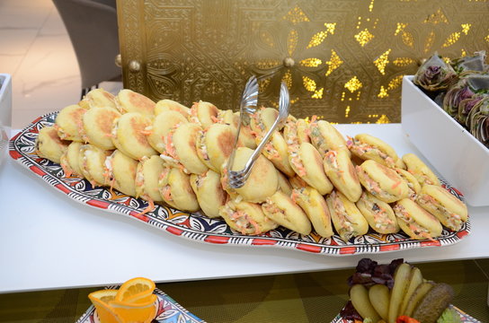 Traditional Moroccan batbot sandwiches filled with sausage, lettuce,cheese and tuna on a dish