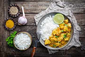 Spicy chicken cooked with curry sauce and rice, top view