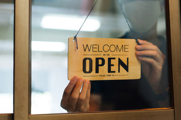 Man re-opening store following covid 19 lockdown, returning to work, back to business, the new...