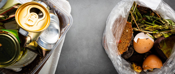Organic food wastes in a bucket, shot from above. Zero waste, recycle, waste sorting concept - top view of peels and leftovers of fruit and vegetables